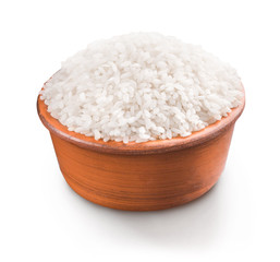 Uncooked white rice in bowl isolated