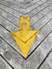 big yellow arrow on the floor