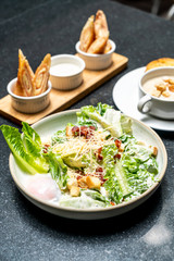 Caesar salad bowl with egg