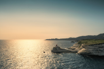Fototapeta premium Evening sun on lighthouse at entrance to Bonifacio port