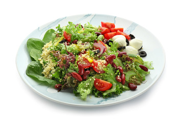 Plate with tasty quinoa salad on white background