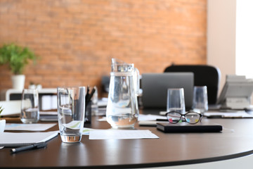 Table prepared for business meeting in conference hall