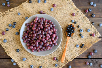 Fresh gooseberry on a plate. It can be used as a background