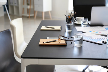 Table prepared for business meeting in conference hall