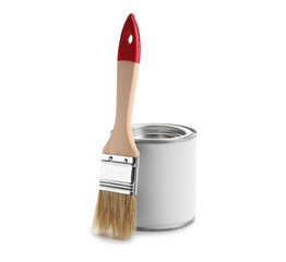 Can of paint and brush on white background