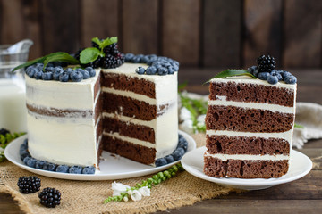 Beautiful tasty cake with white cream and berries of blueberry