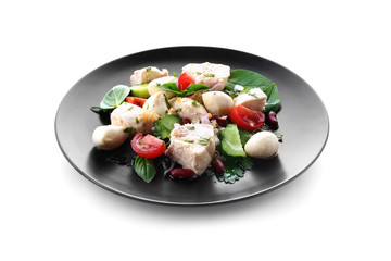 Plate with delicious chicken salad on white background