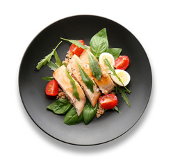 Plate with delicious chicken salad on white background