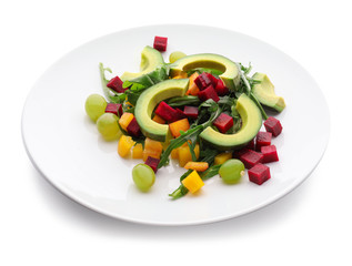 Plate with tasty avocado salad on white background