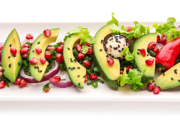 Plate with tasty avocado salad on white background