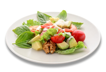 Plate with tasty avocado salad on white background