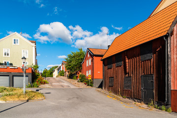 Fototapeta na wymiar The historic street Batsmansgatan in downtown Vastervik on a sunny summer day.