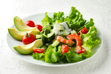 Tasty salad with ripe avocado on plate