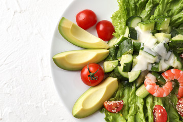 Tasty salad with ripe avocado on plate