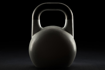 Naklejka na ściany i meble Backlit competition kettlebell silhouette on a fitness studio gym floor with potential copy space on kettlebell
