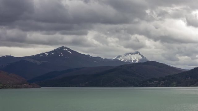 4k timelapse footage of the Ria&ntilde;o Dam with mountains and clouds on the background. Ria&ntilde;o Dam, Castilla e Le&oacute;n, Spain.