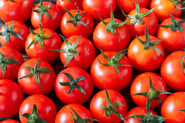 A lot of red tomatoes. Culinary background.