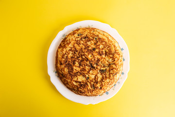 potato omelet on colorful background