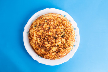 potato omelet on colorful background