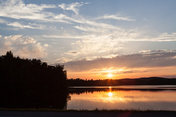 Sunset at lakeside serene summer evening