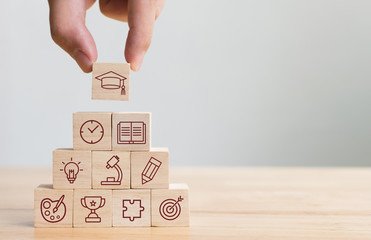 Hand arranging wood block stacking with elements education icon. Diagram of knowledge graduation...
