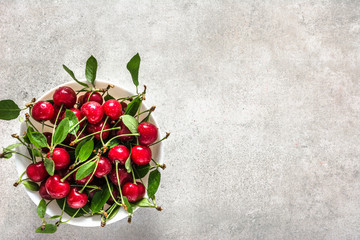 Fresh cherry fruit, organic sweet cherries with leaves, overhead