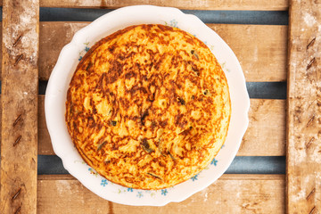 potato omelet on wooden background