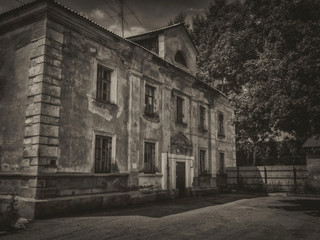 Old residential building. Kazakhstan (Ust-Kamenogorsk). Old architecture. Architectural heritage. Black and white photo. Vintage style. Grunge architecture