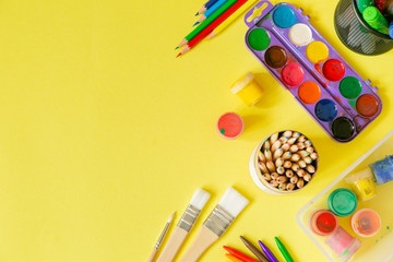 Day care concept - art supplies and toys on bright background