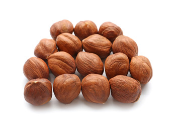Tasty hazelnuts on white background