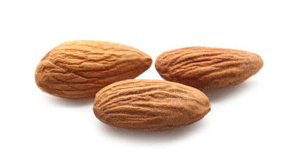 Tasty almonds on white background