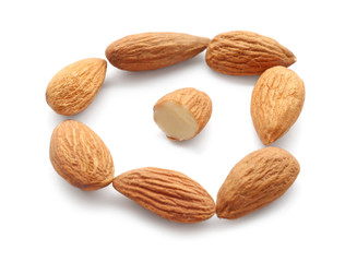 Tasty almonds on white background