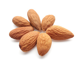 Tasty almonds on white background