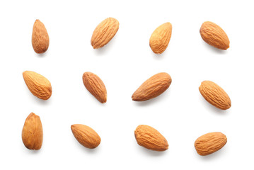 Tasty almonds on white background