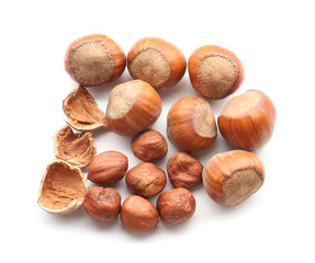 Tasty hazelnuts on white background
