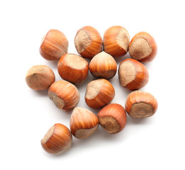 Tasty hazelnuts on white background
