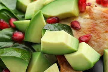 Salad with ripe avocado, closeup
