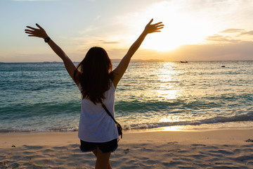 woman hand up feel relax on the beach on holiday