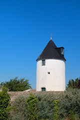 Fototapeta na wymiar Ile de Ré old windmill in village Loix