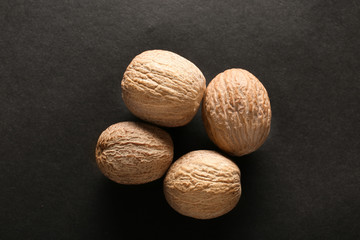Nutmegs on dark background