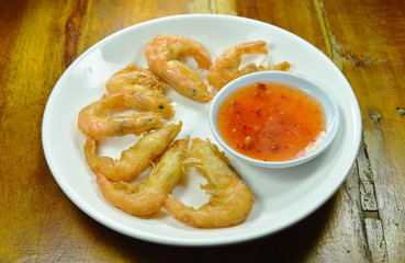 crispy fried shrimp with flour arranging and sweet sauce on plate