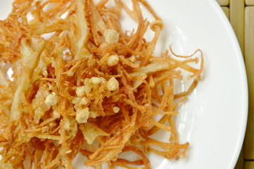 fried crispy needle mushroom on plate