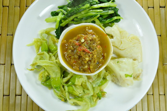 horseshoe crab chili paste eat couple with variety boiled vegetable on plate