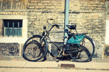Fototapeta na wymiar Old vintage bicycle against a beautiful brick wall. Transport. Bicycles.