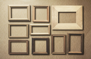 Fototapeta premium old frames on wooden wall
