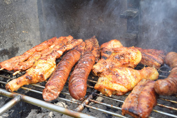 sausages, shish kebabs chicken and bacon baked on the grill