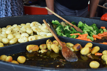 potatoes and vegetables baked in a stone pot at a picnic