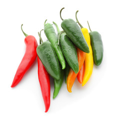 Fresh hot chili peppers on white background