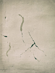 The wall of the old house. Cracks on the surface. Background