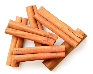 cinnamon sticks isolated on the white background, top view